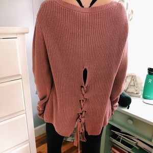 Oversized pink lace up sweater.
